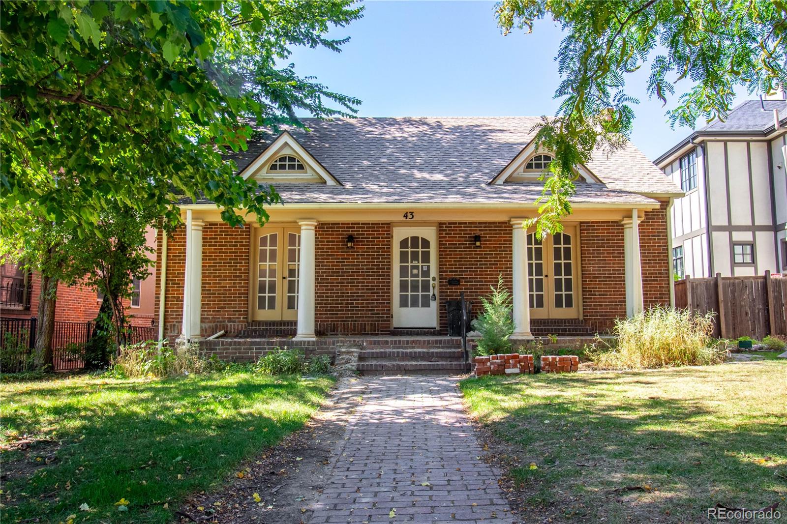 43 Albion Street Denver, CO 80220 - Photo 1 of 25 a front view of a house with garden
