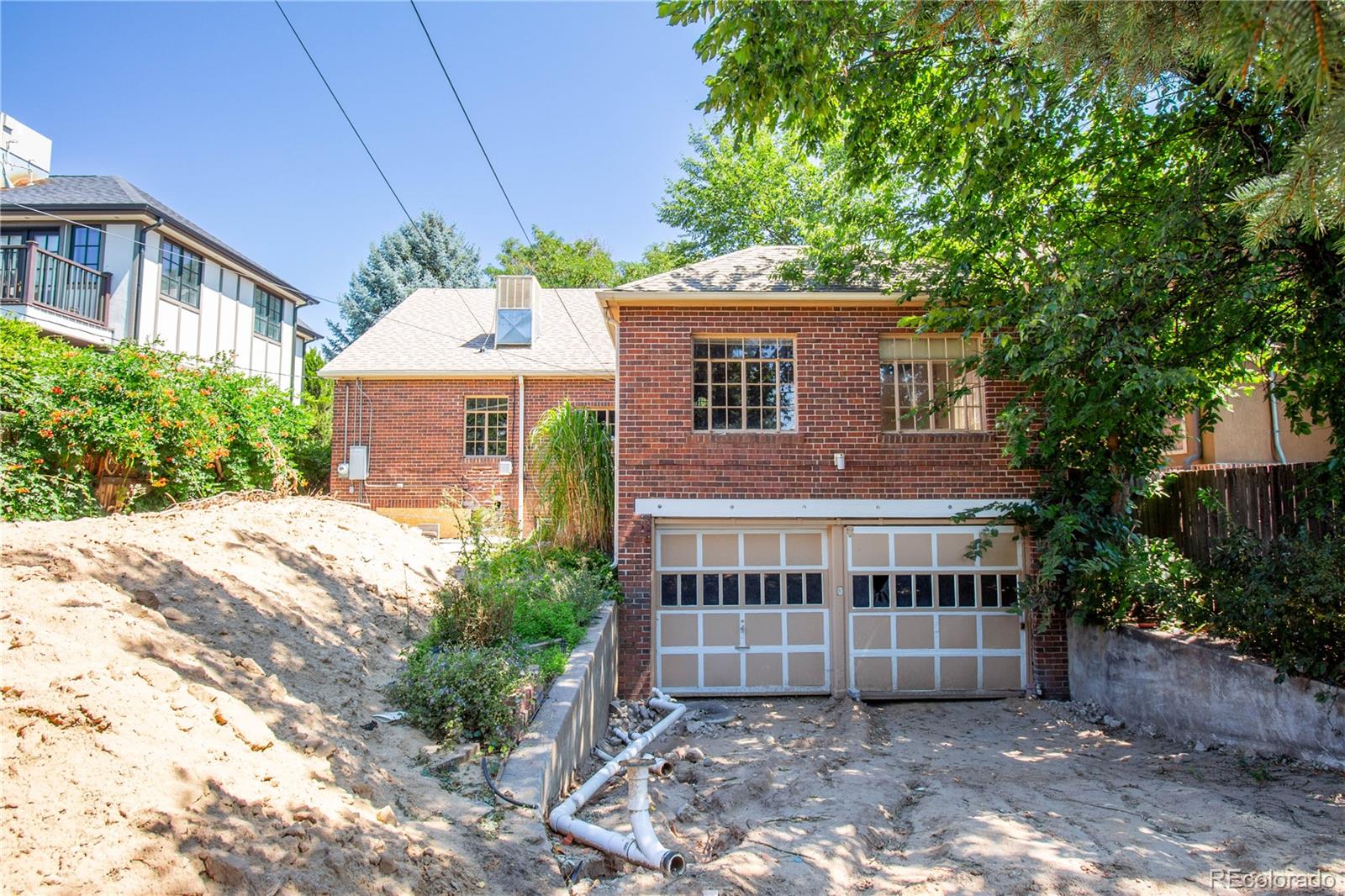 43 Albion Street Denver, CO 80220 - Photo 13 of 25 a front view of a house with a garden