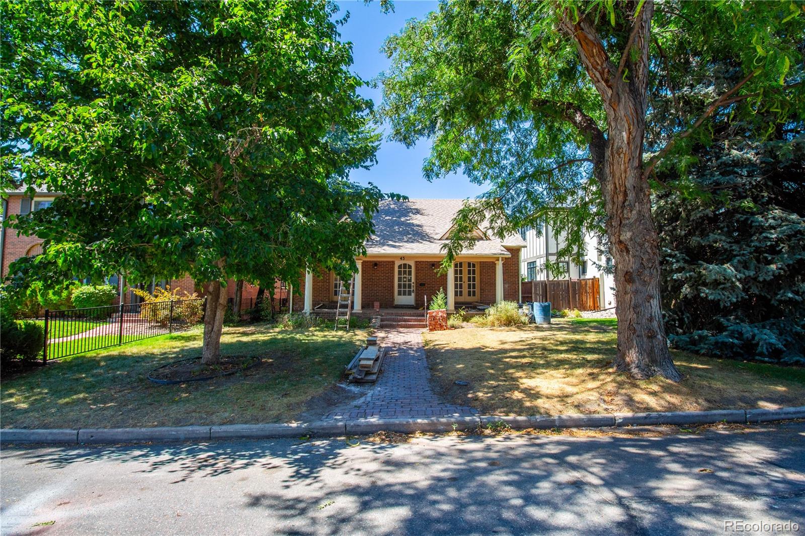 43 Albion Street Denver, CO 80220 - Photo 2 of 25 a view of a yard with plants and trees