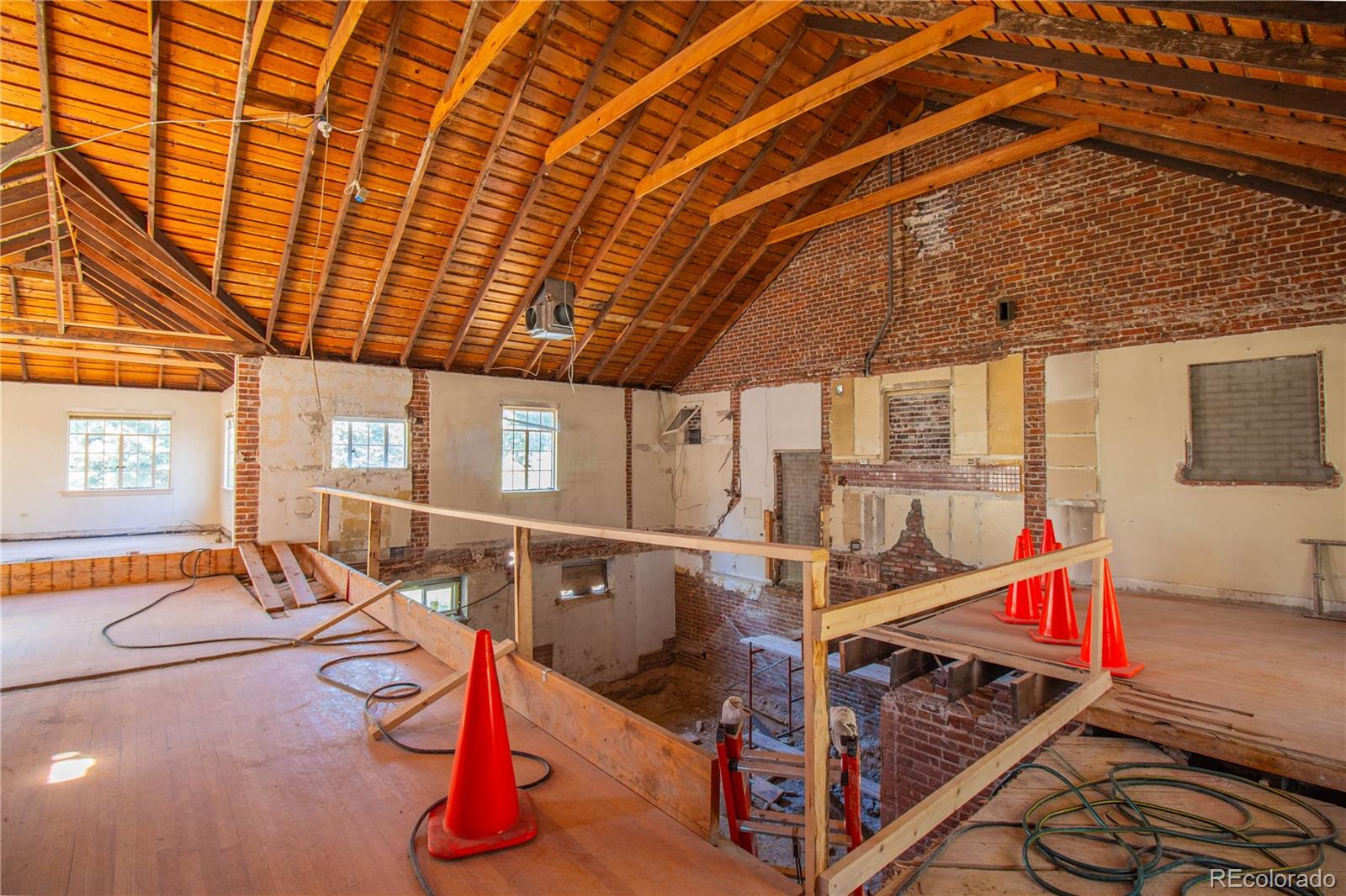 43 Albion Street Denver, CO 80220 - Photo 6 of 25 a view of a room with wooden floor and entryway