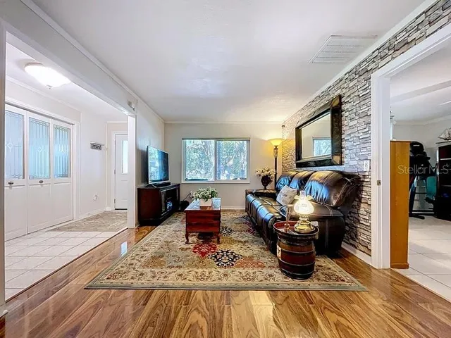 a living room with furniture and a window