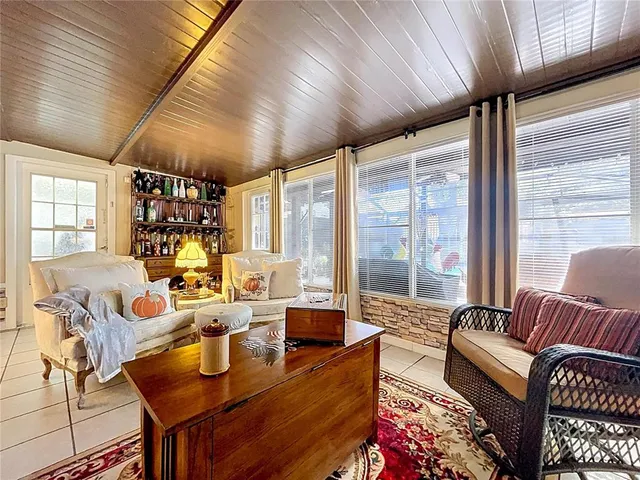 a view of a chair and table in the garden