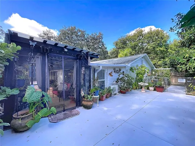 a outdoor living space with furniture and a rug