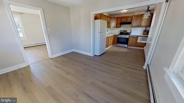 a view of kitchen and wooden floor
