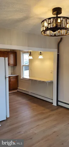 a view of a living room with hardwood floor