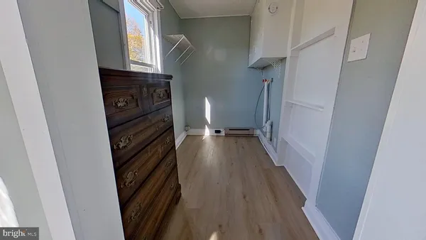a view of a kitchen from a hallway