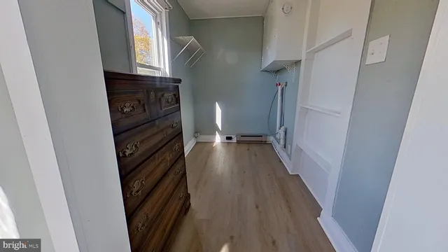 a view of a kitchen from a hallway