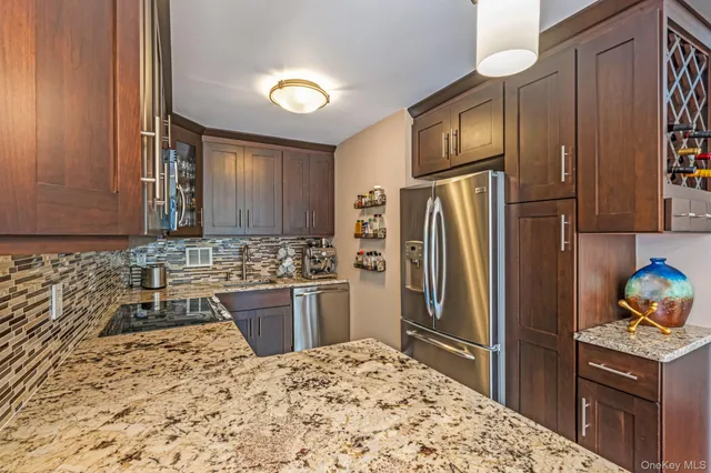 a kitchen with a refrigerator sink and stove