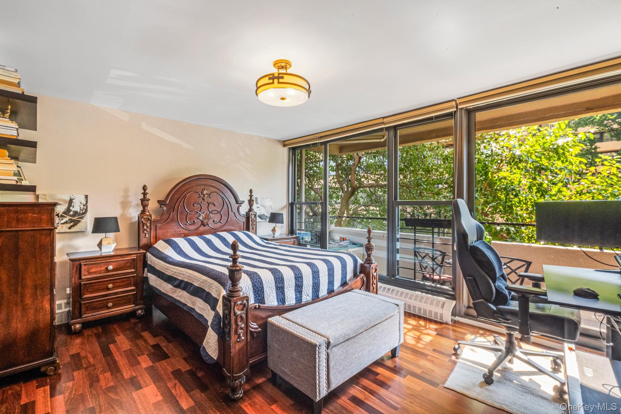 168-01 12th Avenue, Unit 3A Queens, NY 11357 - Photo 13 of 22 a bedroom with a bed and a gate