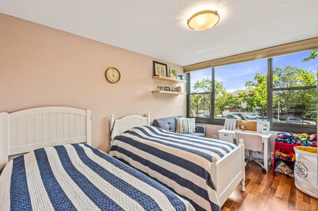 a bedroom with bed and a window