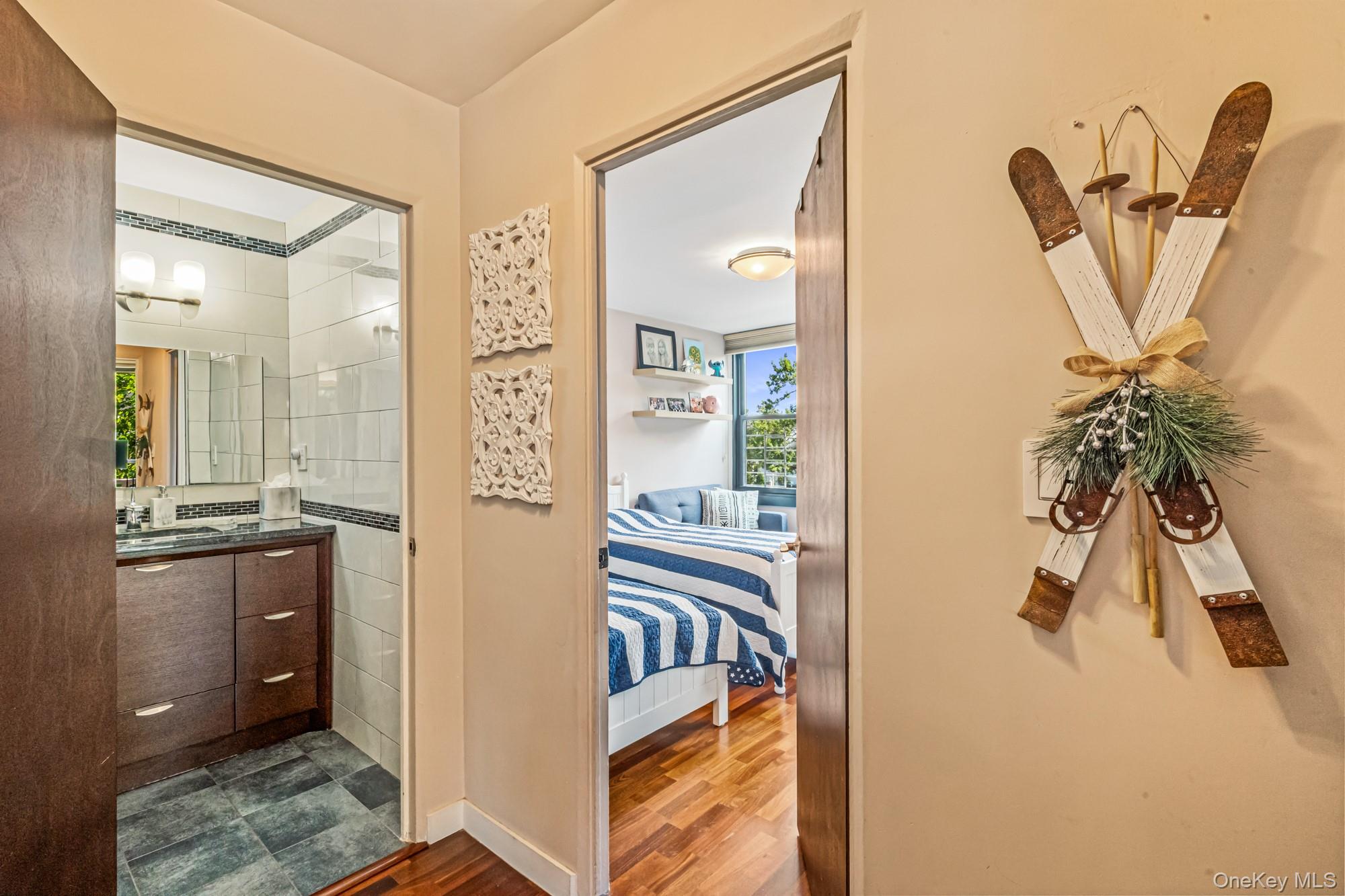 168-01 12th Avenue, Unit 3A Queens, NY 11357 - Photo 18 of 22 a view of a walk in closet and bathroom