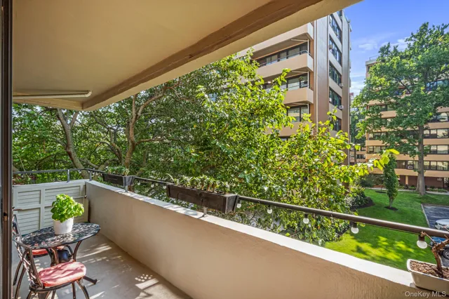 a view of a balcony with chairs