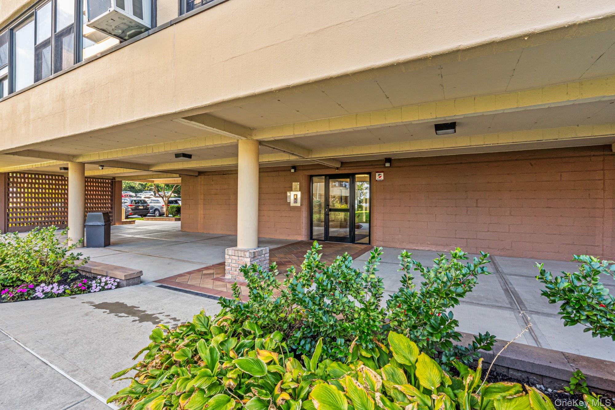 168-01 12th Avenue, Unit 3A Queens, NY 11357 - Photo 3 of 22 a front view of a house with garden