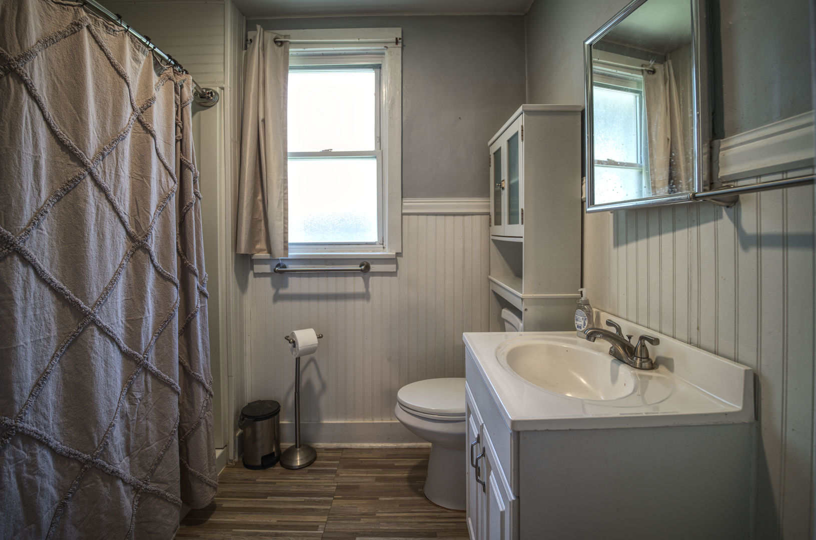 2108 Camanche Avenue Clinton, IA 52732 - Photo 9 of 22 a bathroom with a sink a toilet and shower
