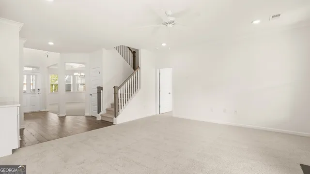 a view of entryway and hall with wooden floor