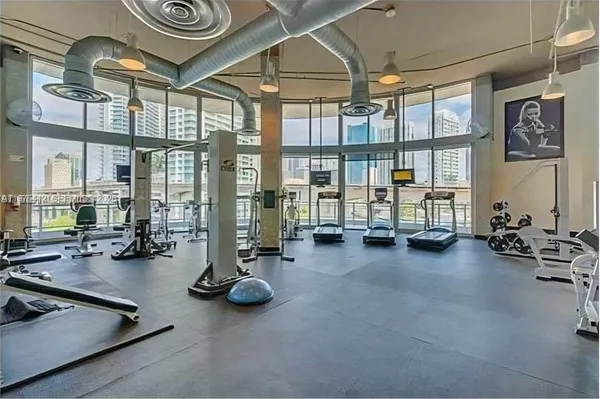 a room with lots of furniture and chandelier