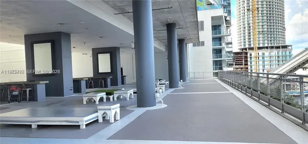 a backyard of a house with portable swimming pool and outdoor seating