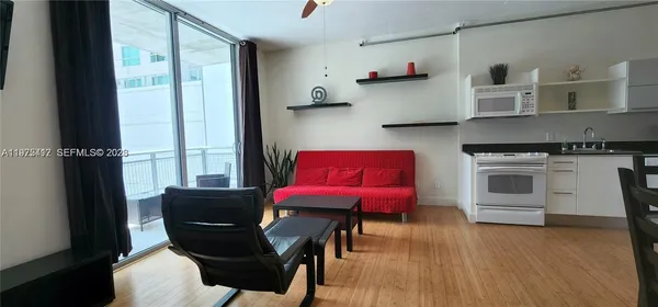 a kitchen with stainless steel appliances a stove a refrigerator and cabinets