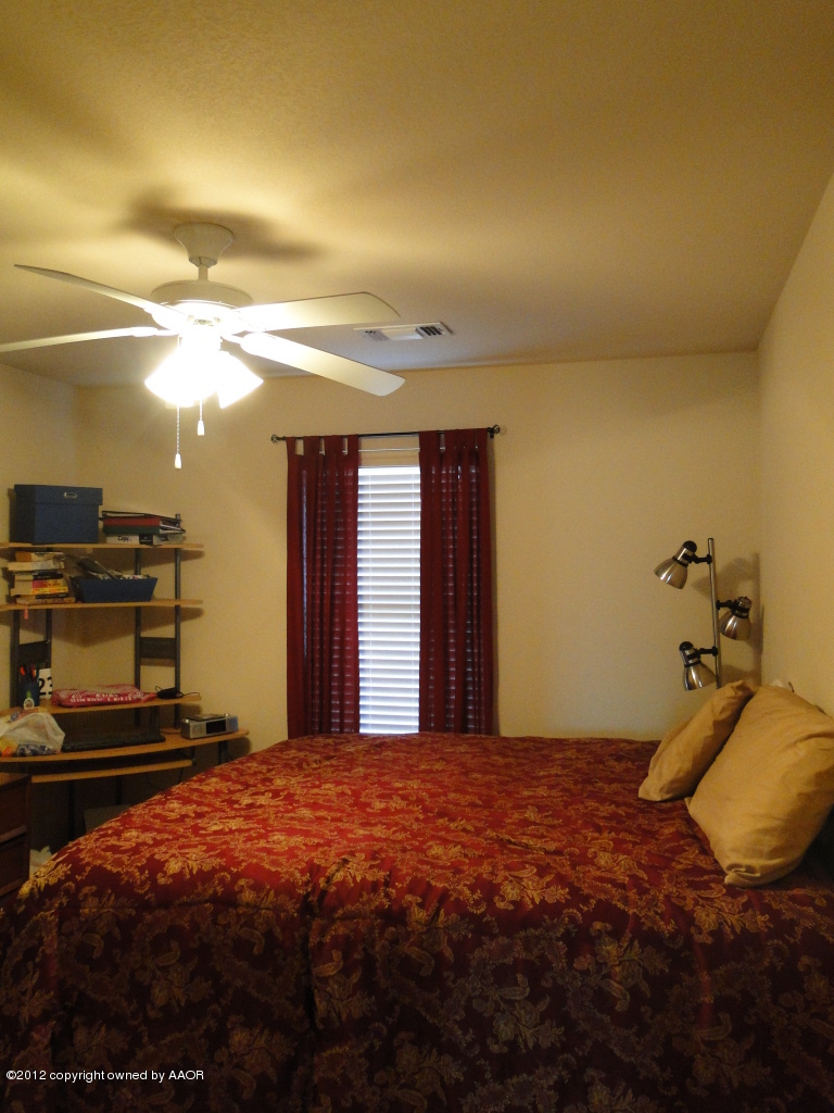 4805 Nimbus Lane Amarillo, TX 79110 - Photo 12 of 15 a bedroom with a bed and a view of balcony