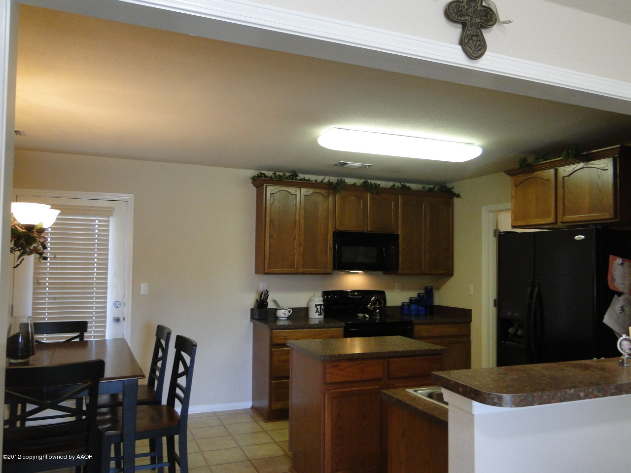 4805 Nimbus Lane Amarillo, TX 79110 - Photo 4 of 15 a kitchen with granite countertop a stove and a refrigerator