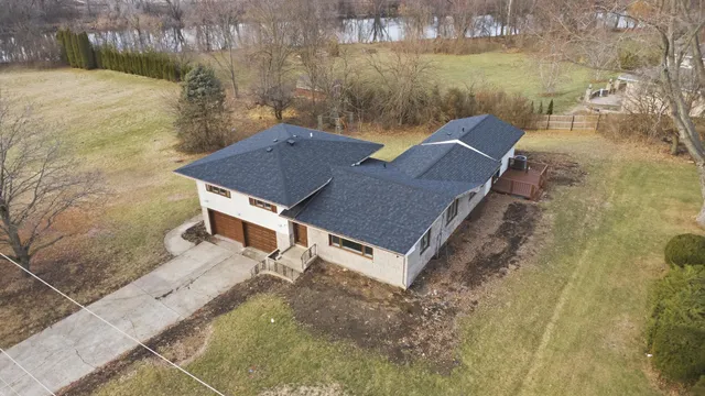 a aerial view of a house with a yard