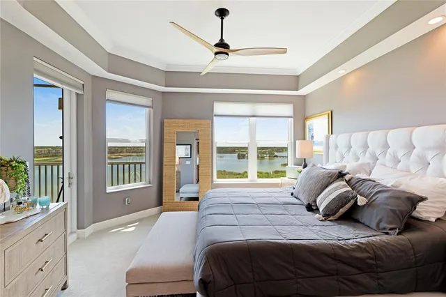 a room with a bed and a mirror