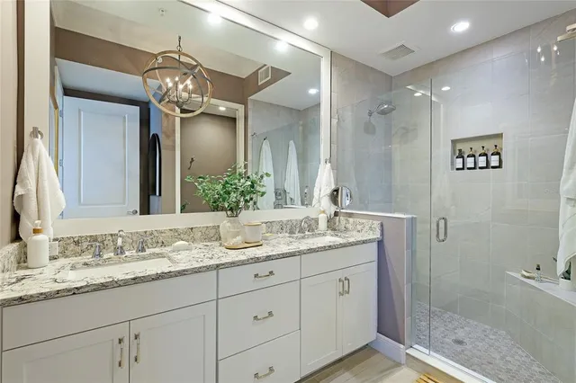 a view of walk in closet with clothes