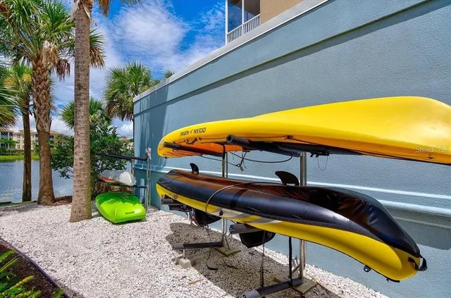 a swimming pool with outdoor seating and lake view