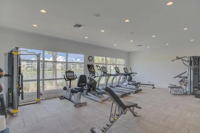 a view of a lake with couches and city view