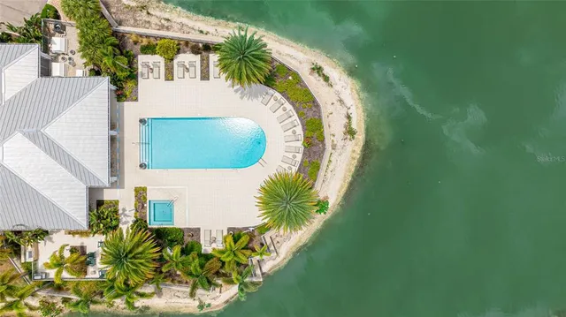 a view of a dining room with furniture and a window