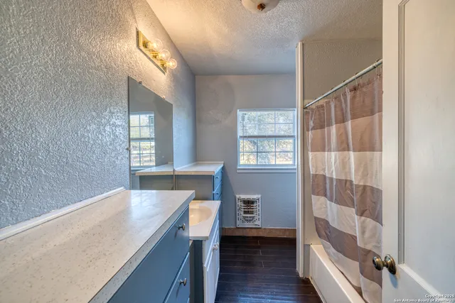 a bathroom with a sink and a bathtub