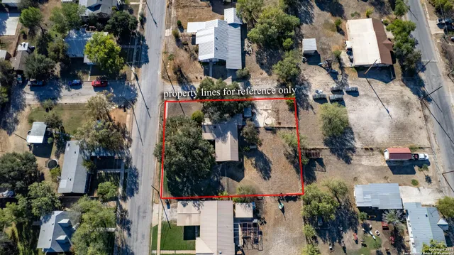 an aerial view of houses with outdoor space
