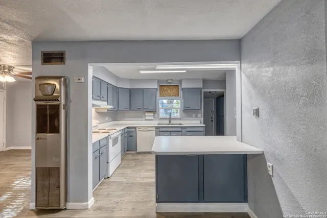 a large kitchen with cabinets