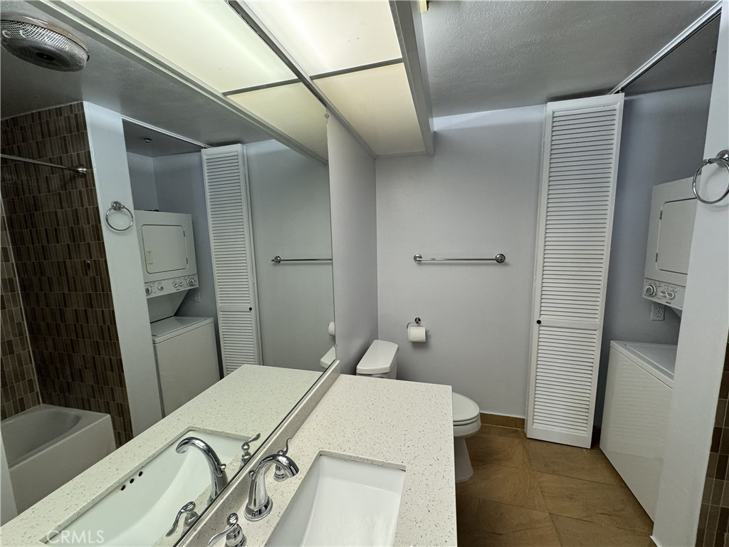 222 South Central Avenue, Unit 214 Los Angeles, CA 90012 - Photo 12 of 21 a bathroom with a sink and mirror