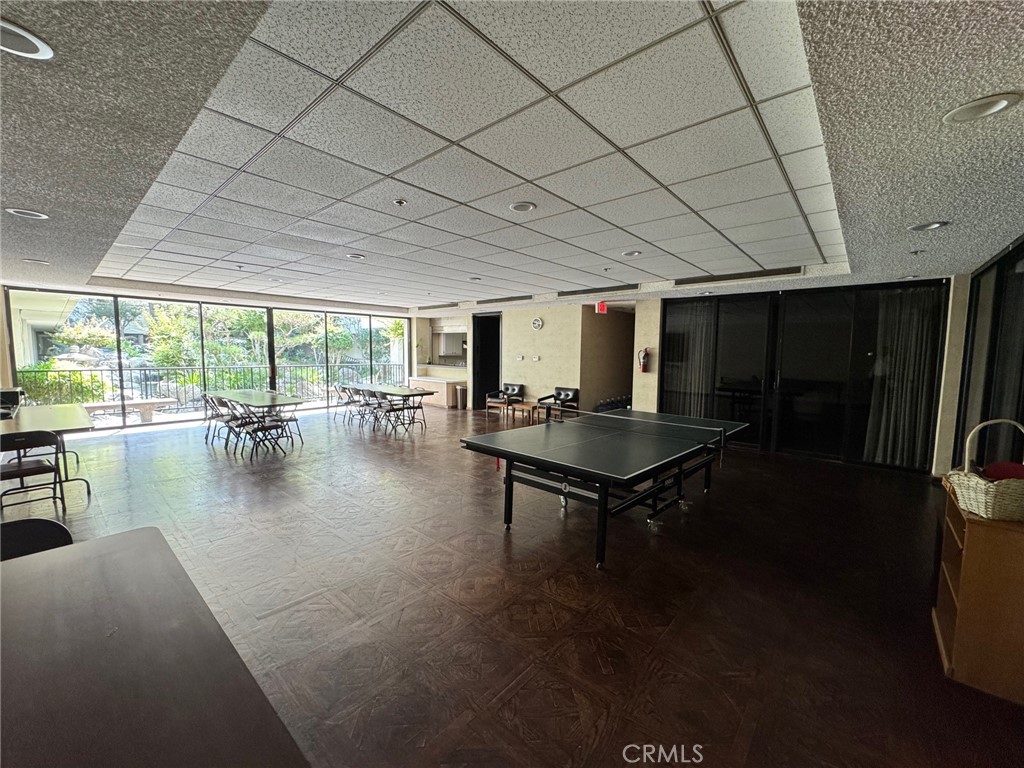 222 South Central Avenue, Unit 214 Los Angeles, CA 90012 - Photo 18 of 21 a living room with furniture a table and a floor to ceiling window