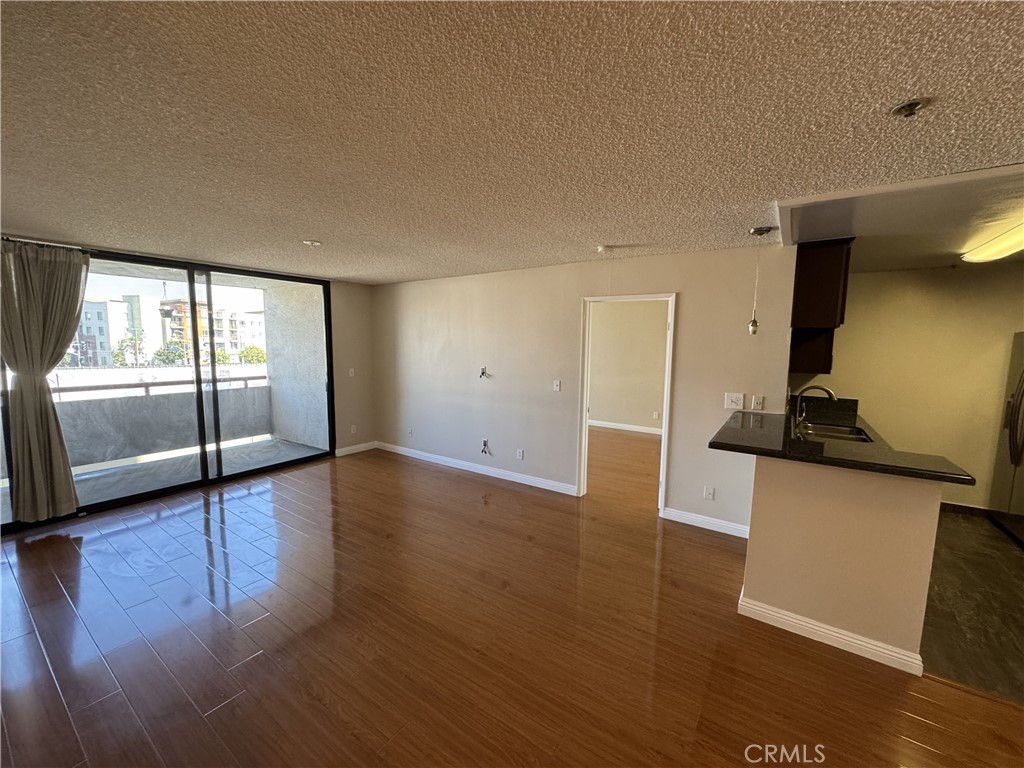 222 South Central Avenue, Unit 214 Los Angeles, CA 90012 - Photo 8 of 21 a view of a kitchen with a sink and a window