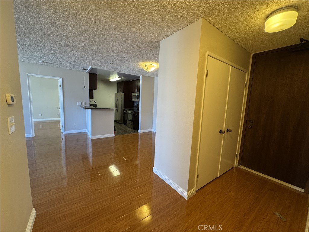 222 South Central Avenue, Unit 214 Los Angeles, CA 90012 - Photo 10 of 21 a view of a hallway with wooden floor