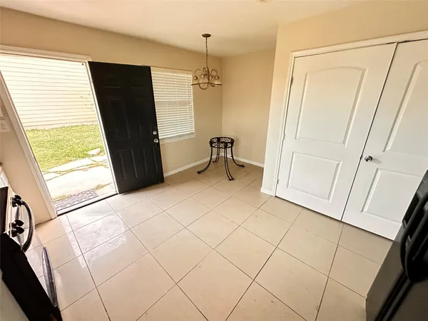a view of an empty room and a window