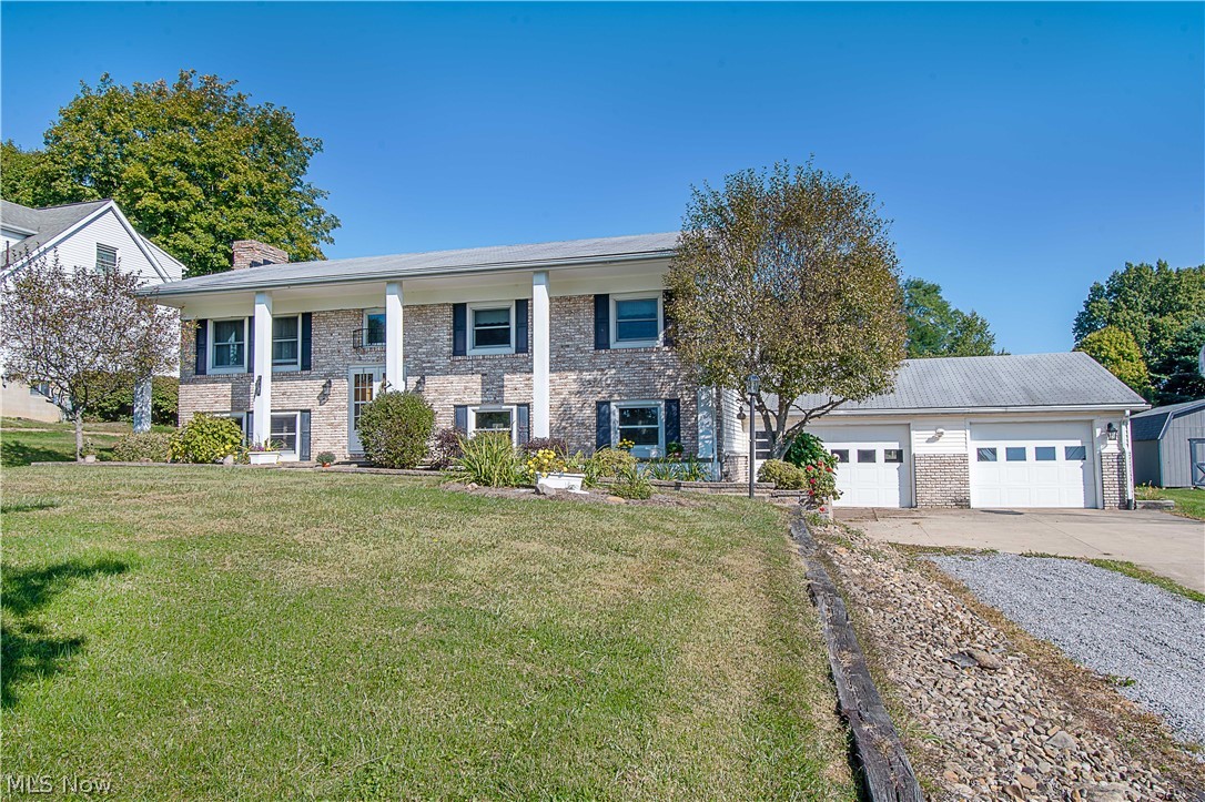 1272 Stewart Road Salem, OH 44460 - Photo 2 of 30 The 2-car garage is oversized (34x36) with different walk-out doors.