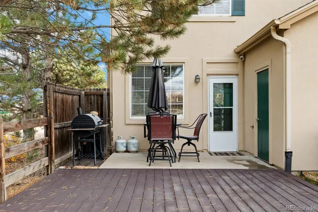 a view of a dinning tables and chairs in patio of the house