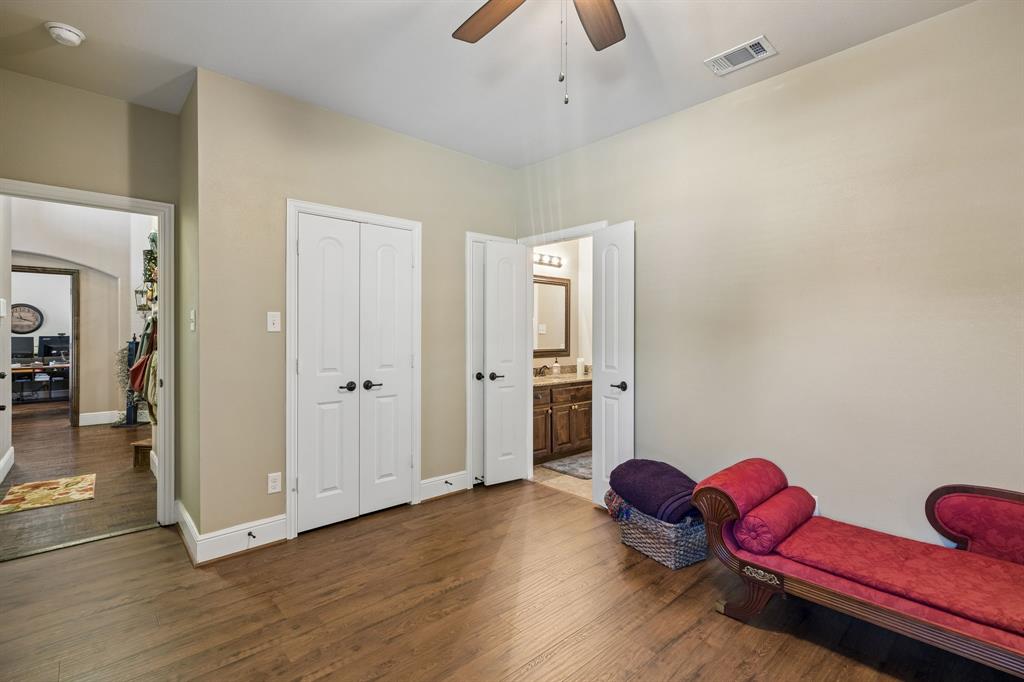 8104 Red Riv Run North Richland Hills, TX 76180 - Photo 18 of 38 a room with furniture and wooden floor