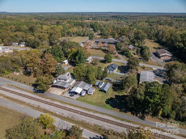 a view of a yard with cars