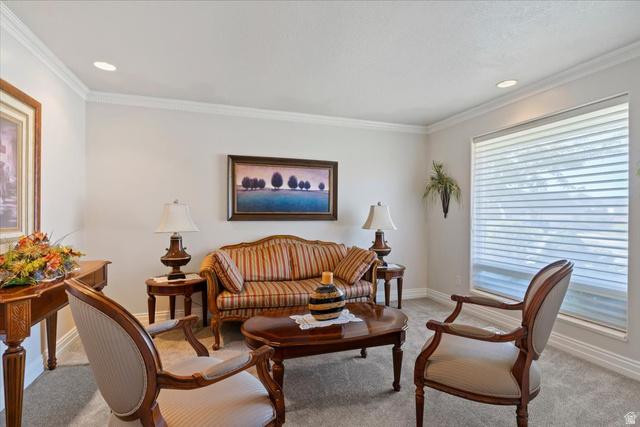 1924 North 2000th Street East Layton, UT 84040 - Photo 8 of 41 Living area featuring light carpet, crown molding, and recessed lighting