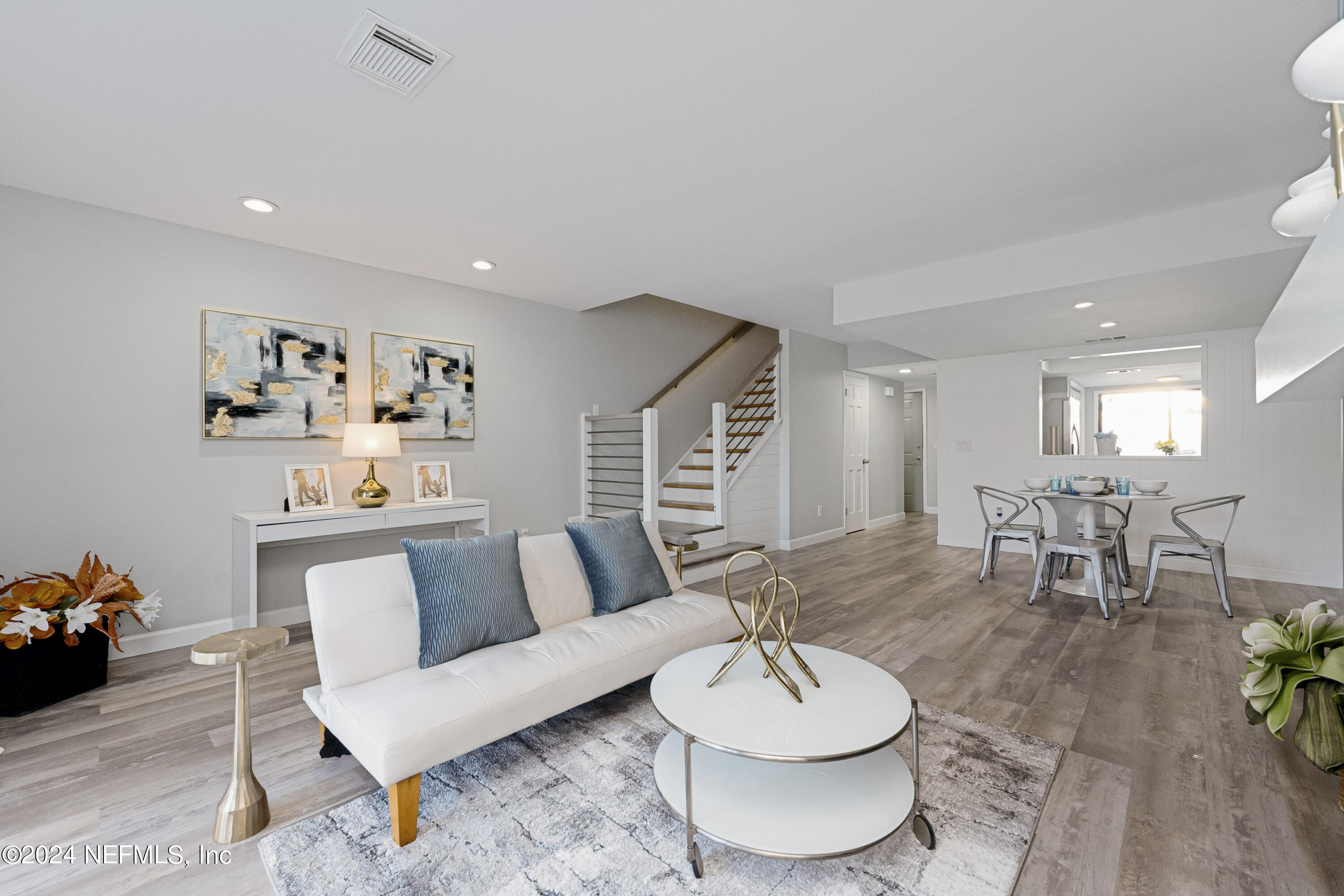 a living room with furniture and a table