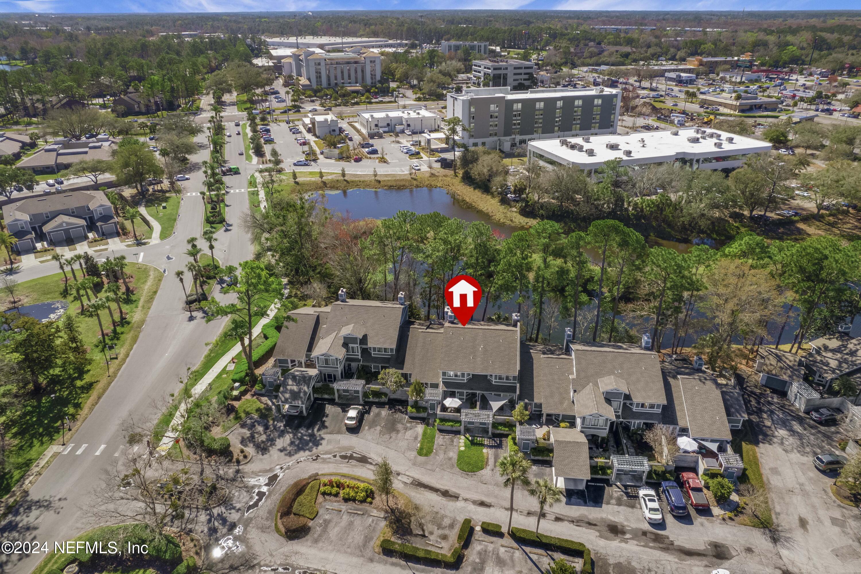 8118 Baymeadows Circle East, Unit 5 Jacksonville, FL 32256 - Photo 2 of 23 an aerial view of a house with a swimming pool yard and outdoor seating