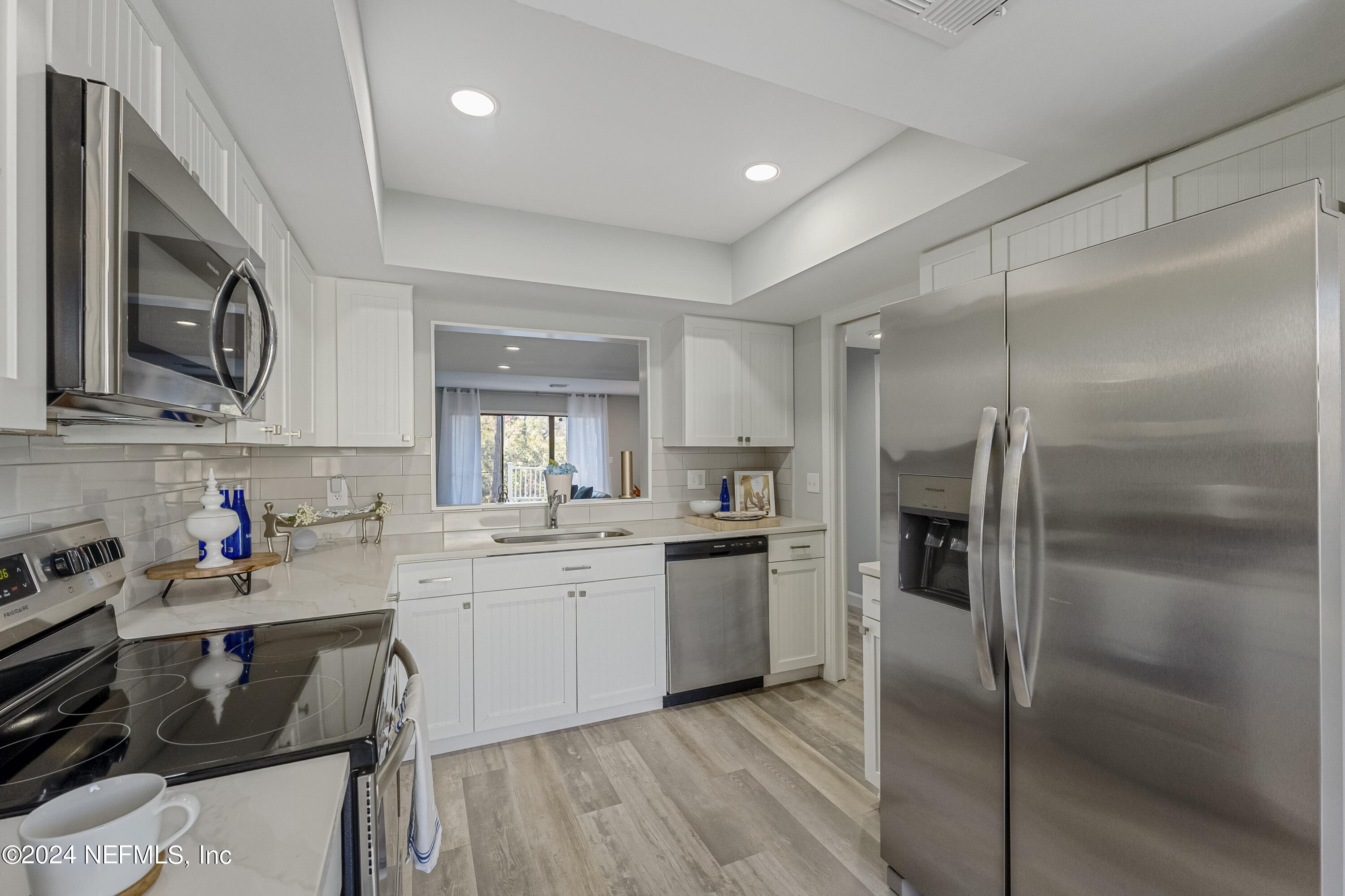 8118 Baymeadows Circle East, Unit 5 Jacksonville, FL 32256 - Photo 9 of 23 a kitchen with a sink stainless steel appliances and cabinets