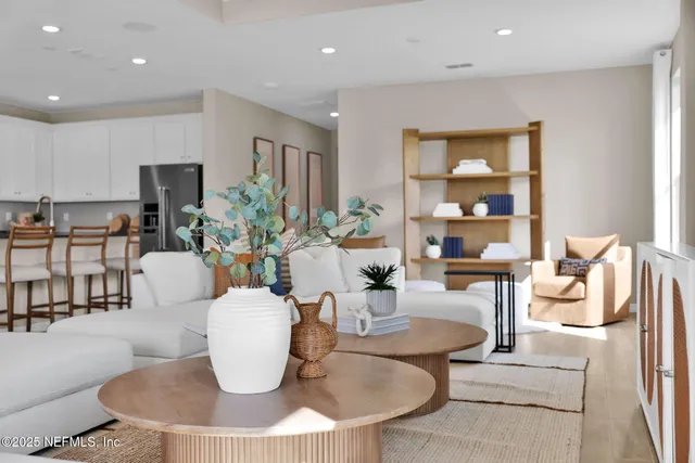 a living room with fireplace furniture and a hard wood floor