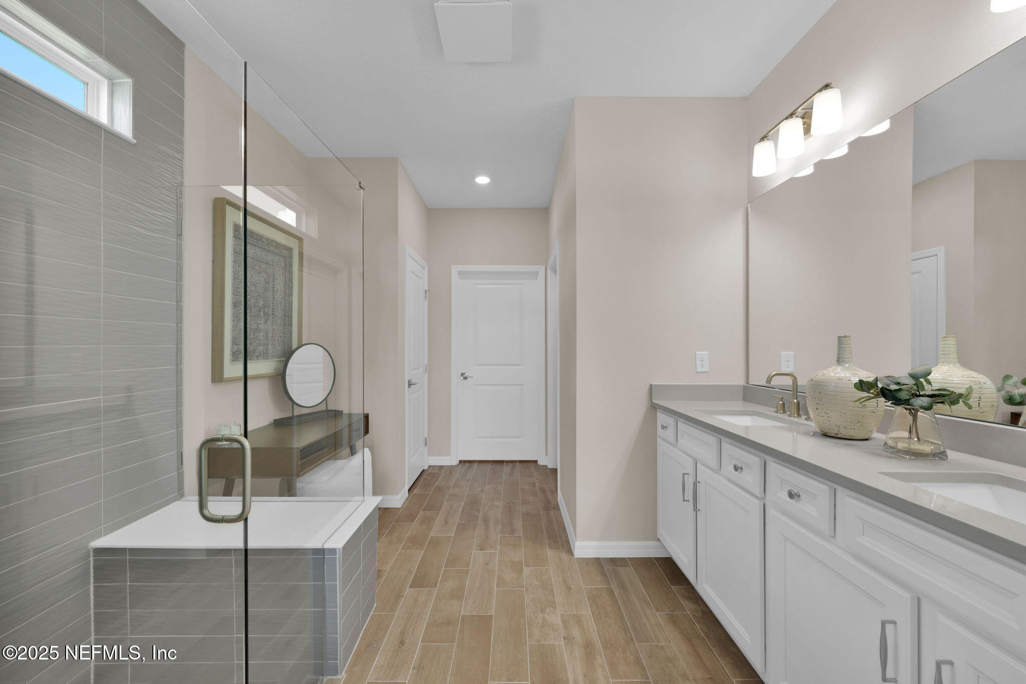 963 Floco Avenue Yulee, FL 32097 - Photo 15 of 47 a spacious bathroom with a double vanity sink and a mirror