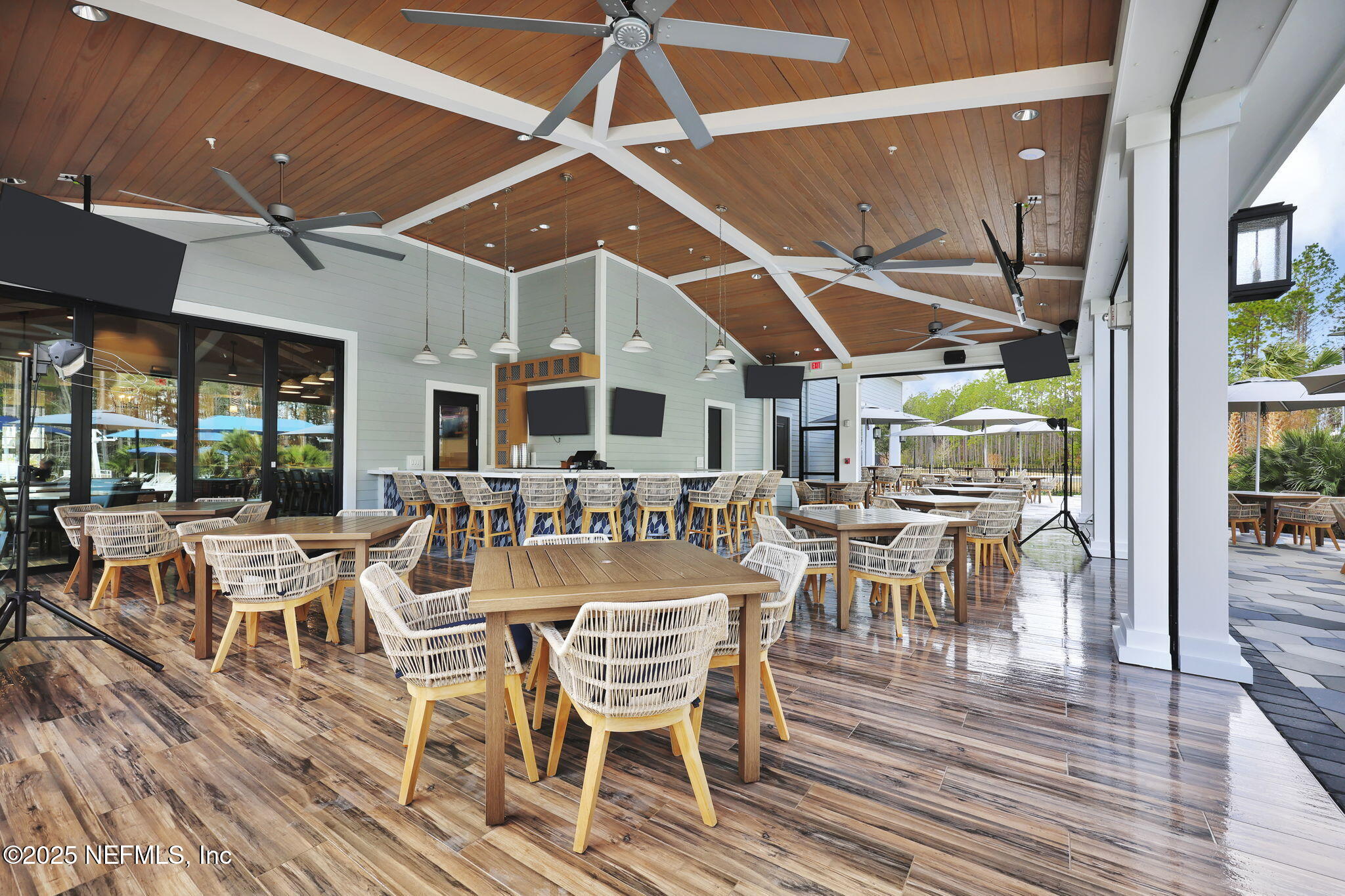 963 Floco Avenue Yulee, FL 32097 - Photo 33 of 47 a view of a dining hall with many windows