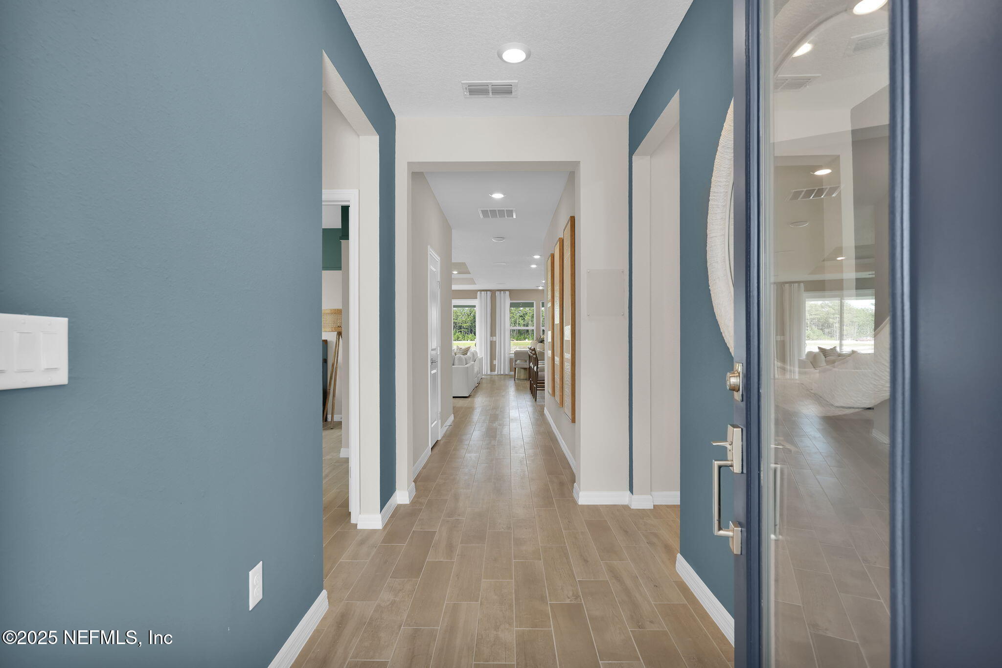 963 Floco Avenue Yulee, FL 32097 - Photo 4 of 47 a view of a hallway with wooden floor